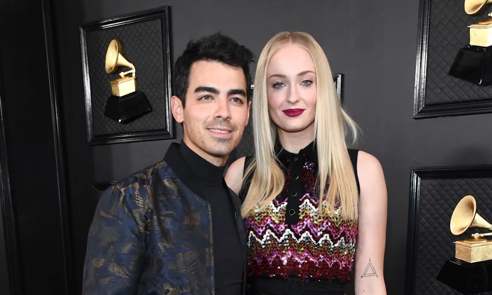 Joe Jonas and Sophie Turner posing together at a red carpet event.