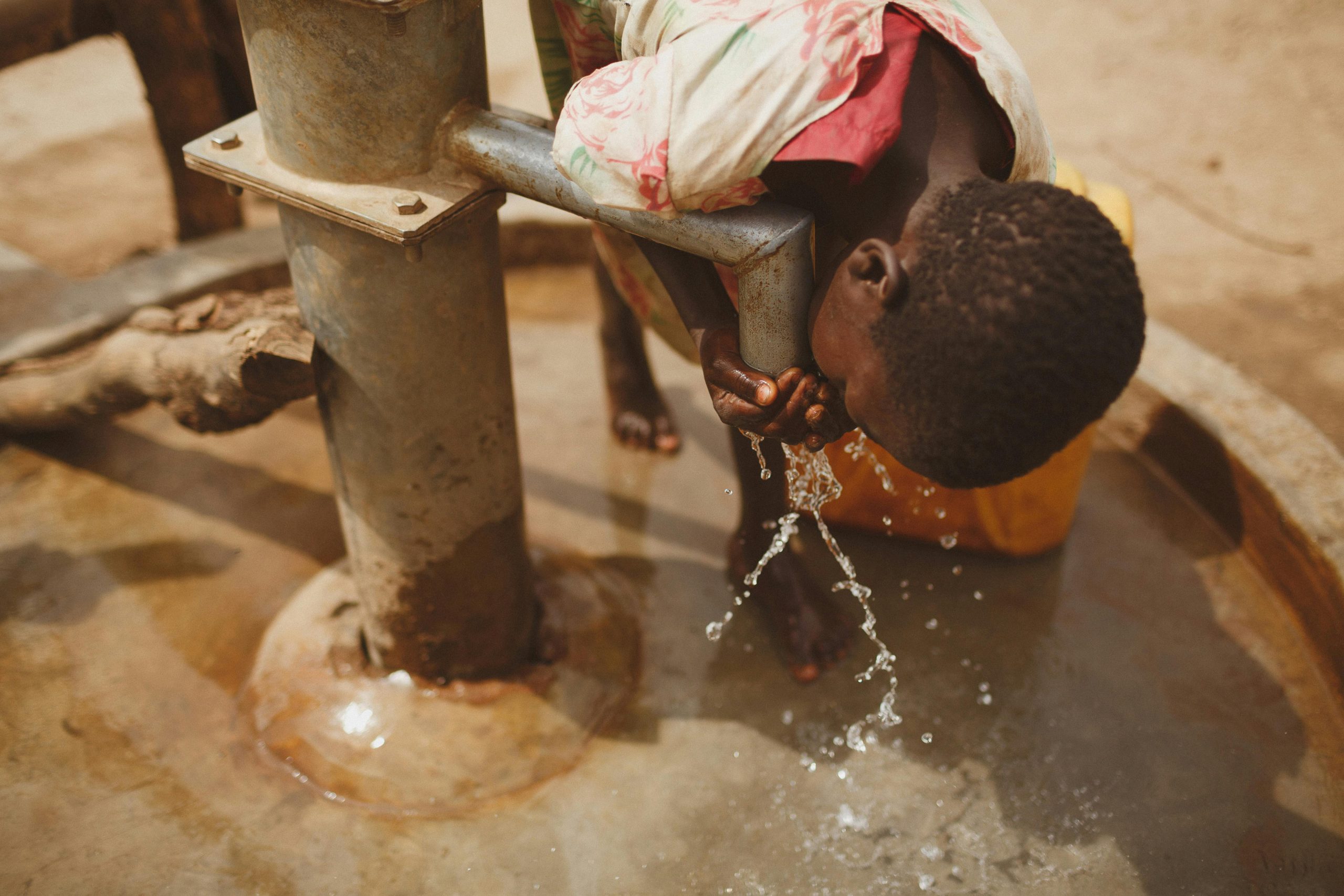 Photo by illustrate Digital Ug: https://www.pexels.com/photo/girl-drinking-water-from-the-pipe-28101461/